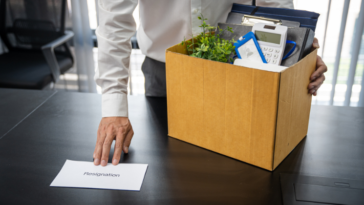 Employee giving a resignation letter